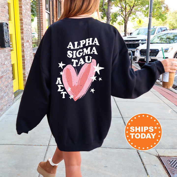 a woman walking down a sidewalk wearing a sweatshirt
