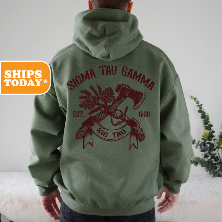 a man wearing a green hoodie with a red graphic on it