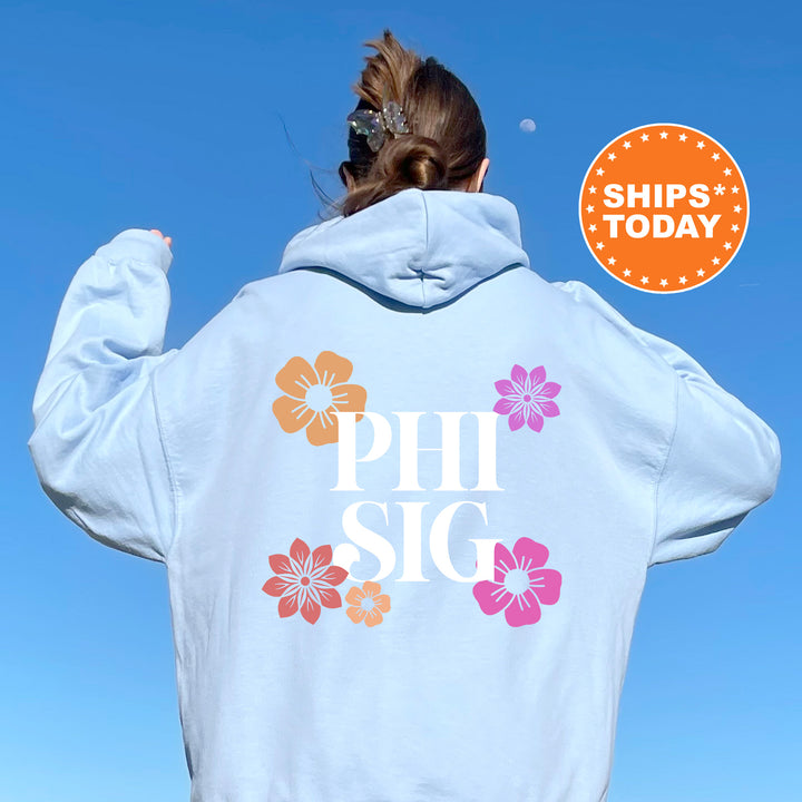 a woman wearing a white hoodie with the words phi sig printed on it