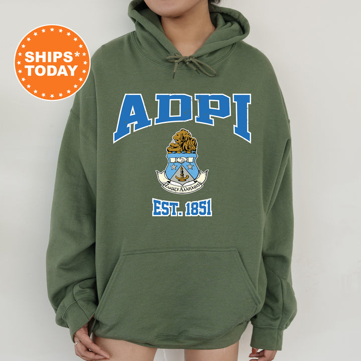 a person wearing a green hoodie with the words adipi on it