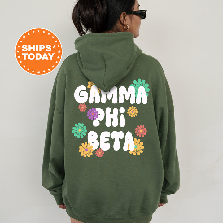 a woman wearing a green hoodie with flowers on it