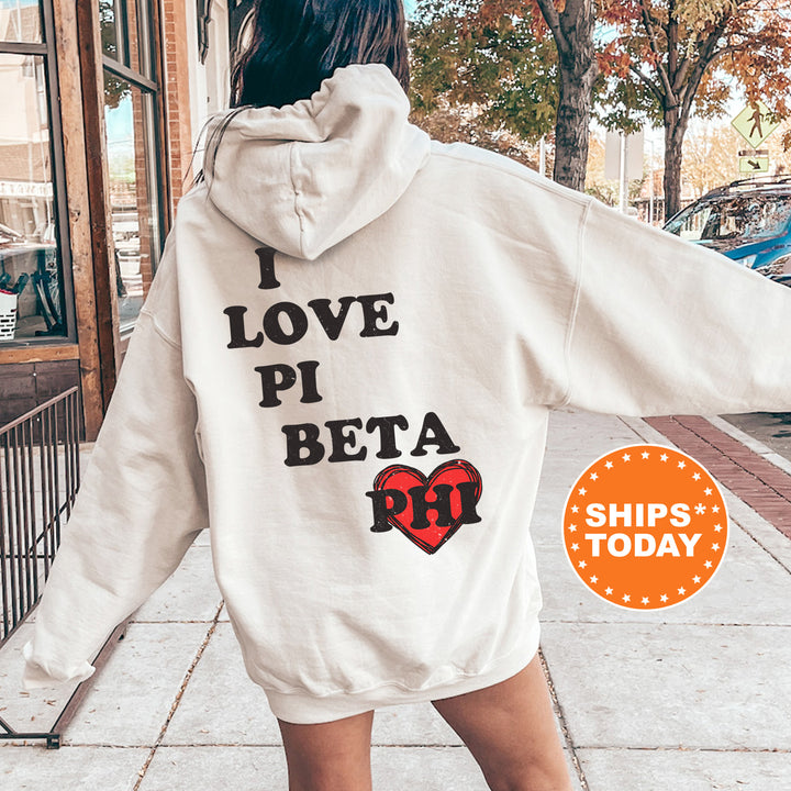 a woman in a white hoodie that says i love pi beta