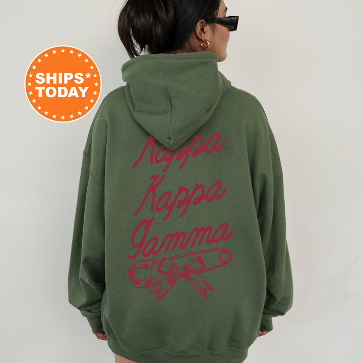 a woman wearing a green hoodie with red writing on it