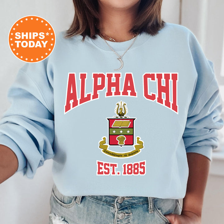 a woman wearing a blue sweatshirt with a red and yellow logo