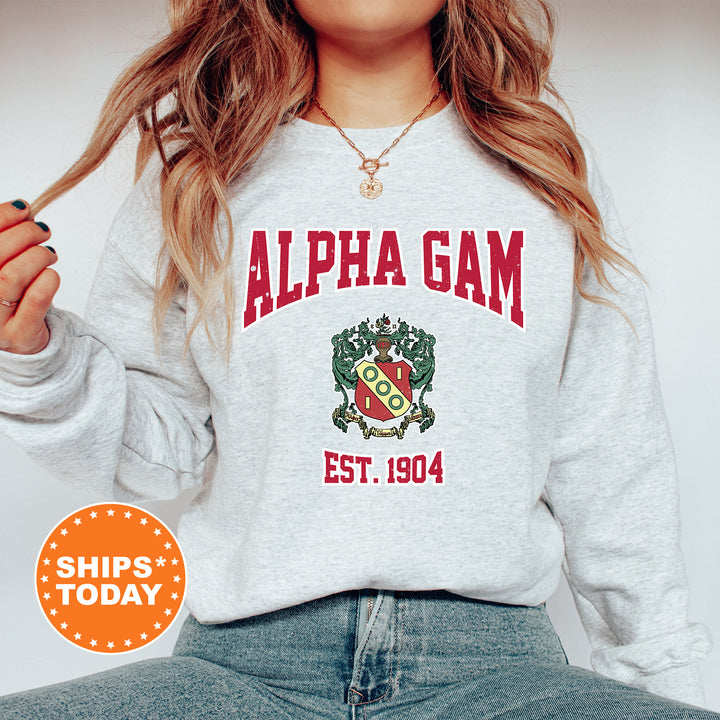 a woman wearing a sweatshirt with the words alpha gam on it