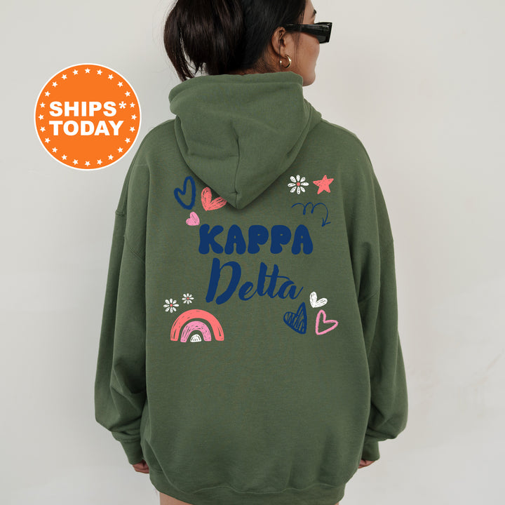 a woman wearing a green hoodie with the words kappa delta on it