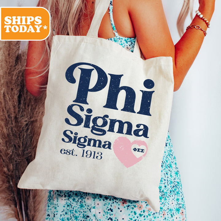 a woman holding a bag that says phi sigma sigma