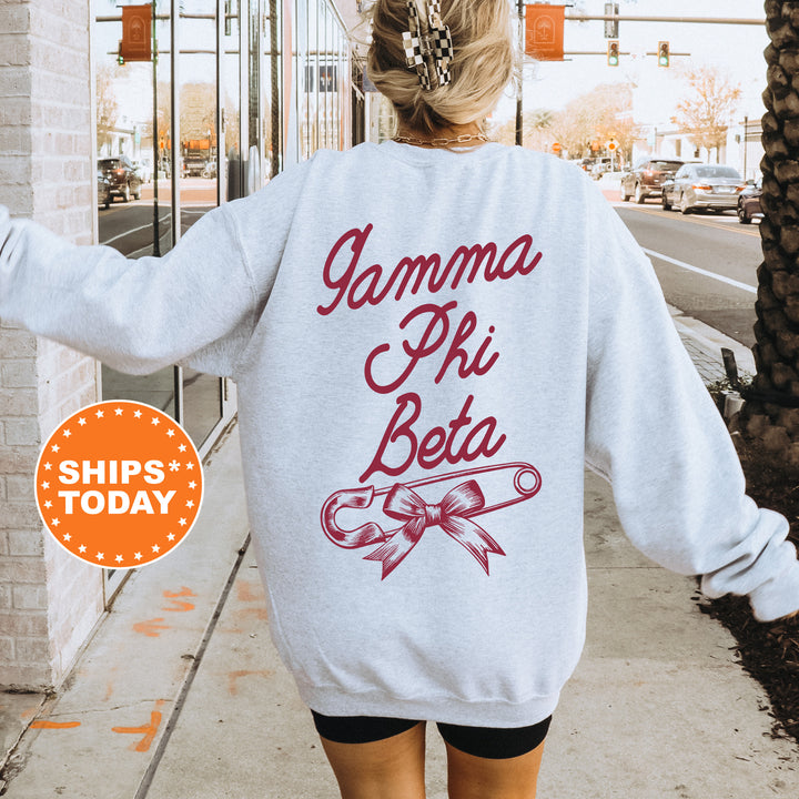 a woman walking down a sidewalk wearing a sweatshirt