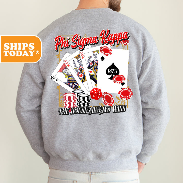 a man wearing a sweatshirt that has a picture of playing cards on it
