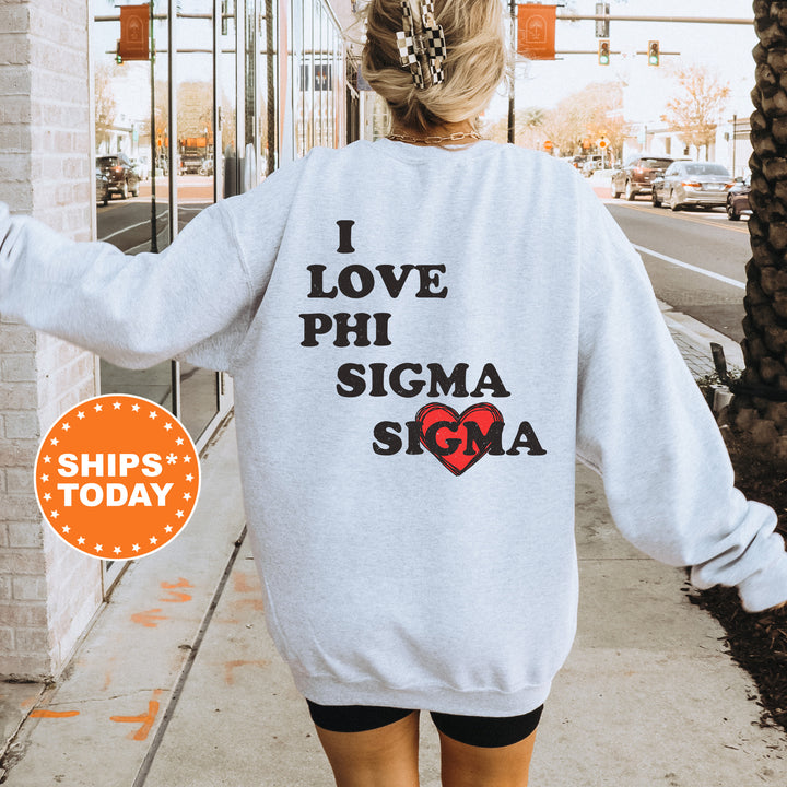 a woman walking down a sidewalk wearing a sweatshirt