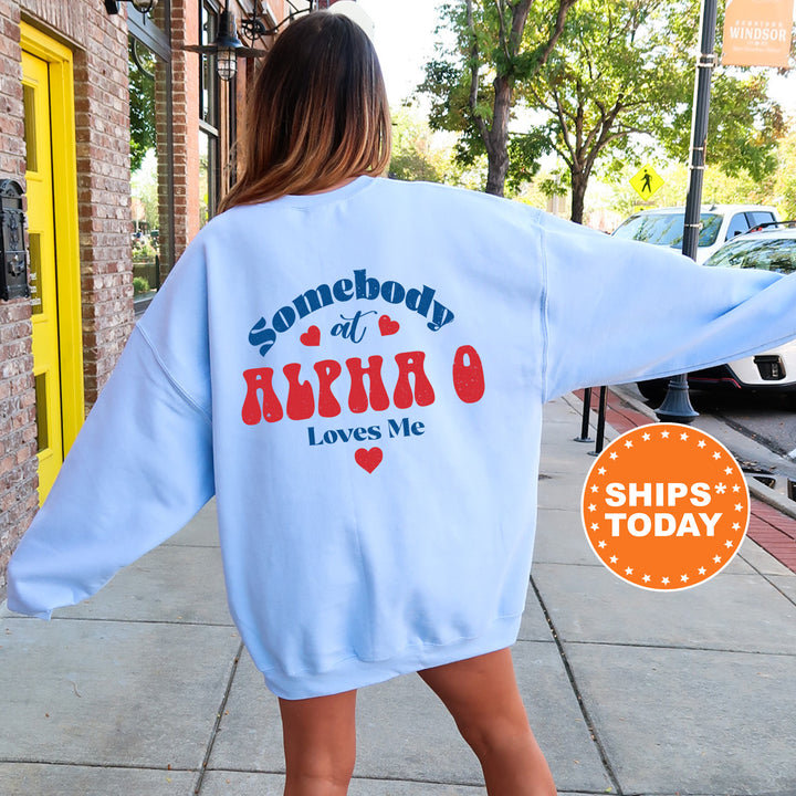 a woman walking down a sidewalk wearing a sweatshirt