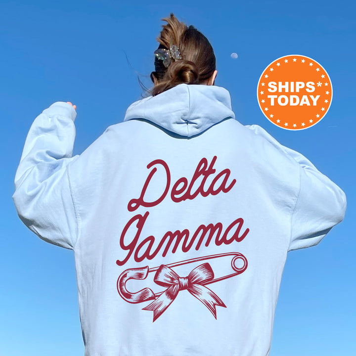 a woman in a white hoodie with the words delta gamma on it