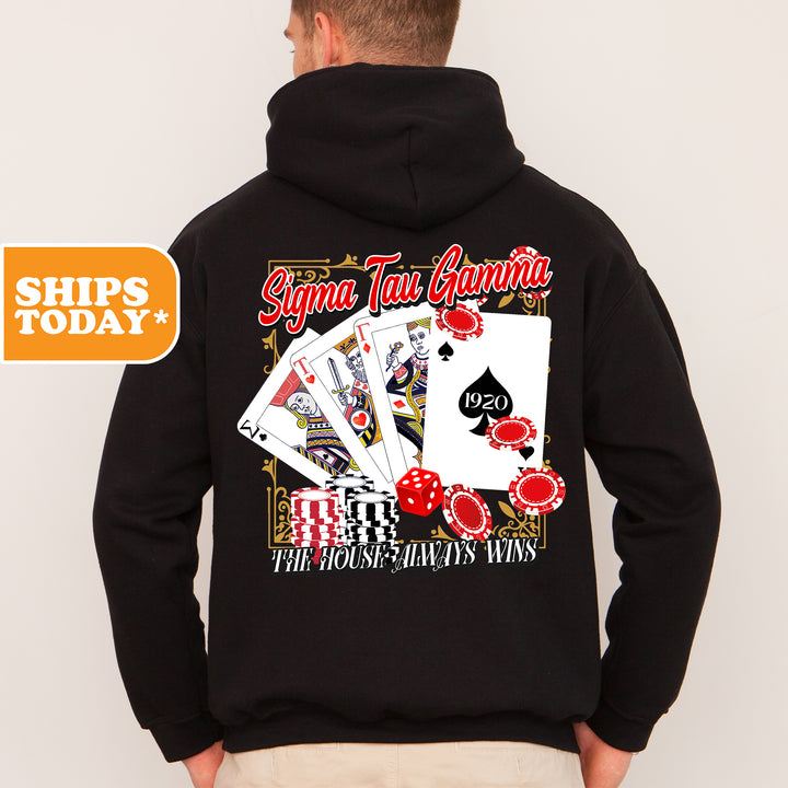a man wearing a black hoodie with a picture of playing cards
