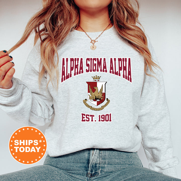 a woman wearing a sweatshirt with a crest on it