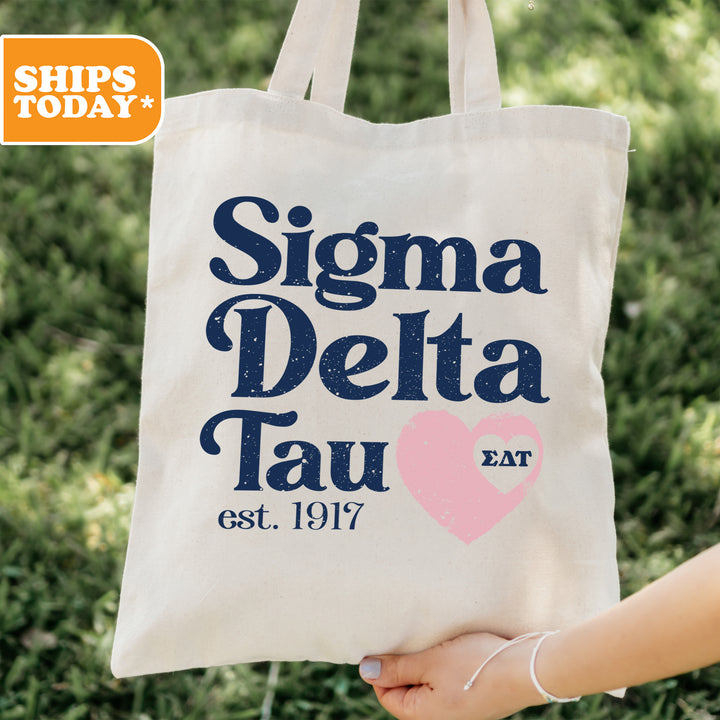 a person holding a bag with a heart on it