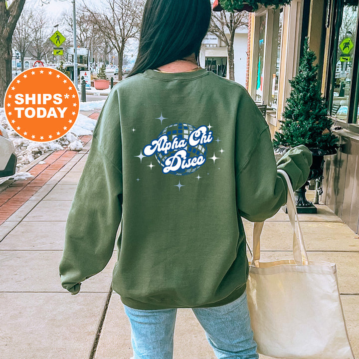 A person wearing a green sweatshirt with the text "Alpha Chi D2X" printed on it, walking on a sidewalk with a shopping bag.