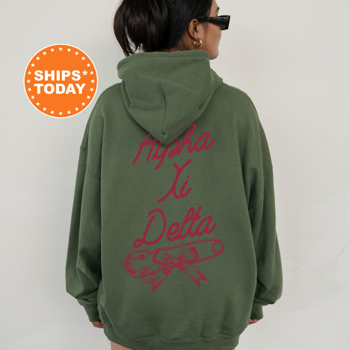 a woman wearing a green hoodie with red writing on it