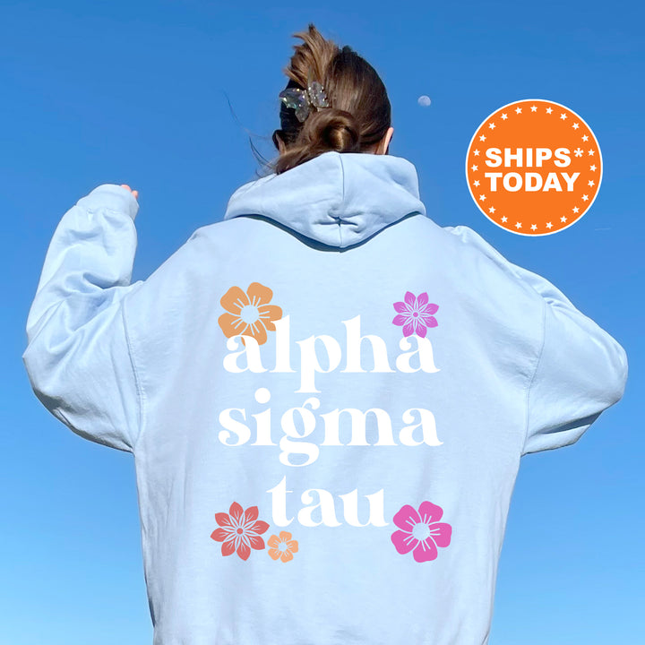 a woman with her back to the camera wearing a white hoodie