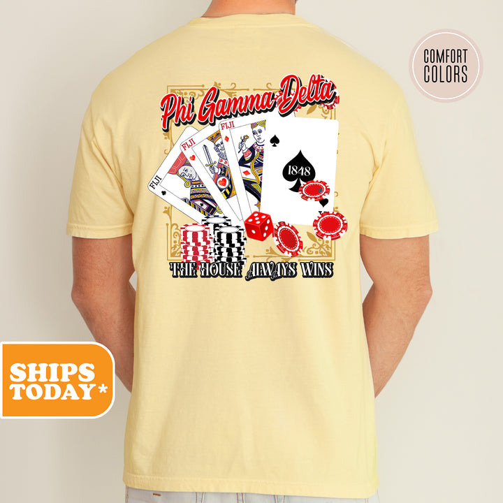 a man wearing a yellow shirt that has a picture of a playing card on it