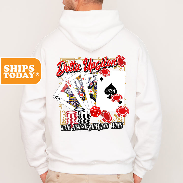 a man wearing a white hoodie with a card design on it