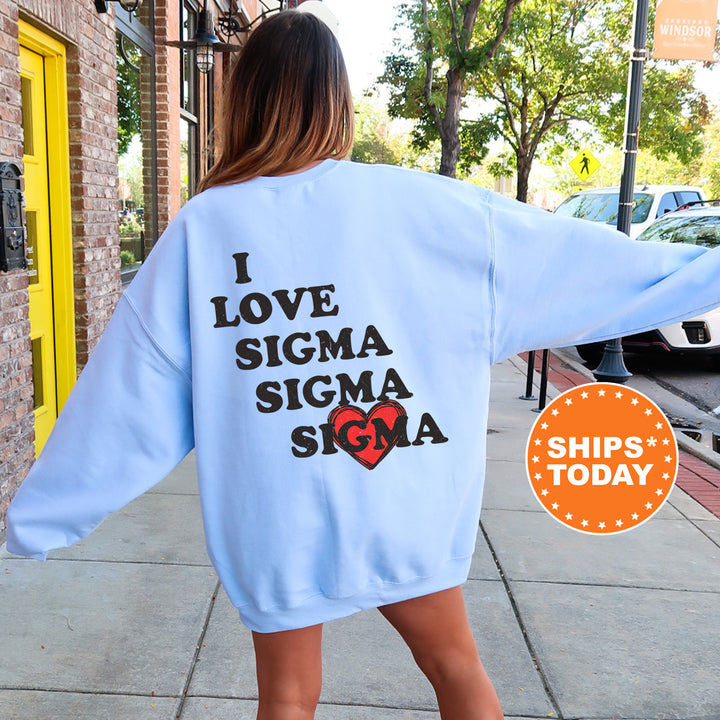 a woman walking down a sidewalk wearing a blue sweatshirt