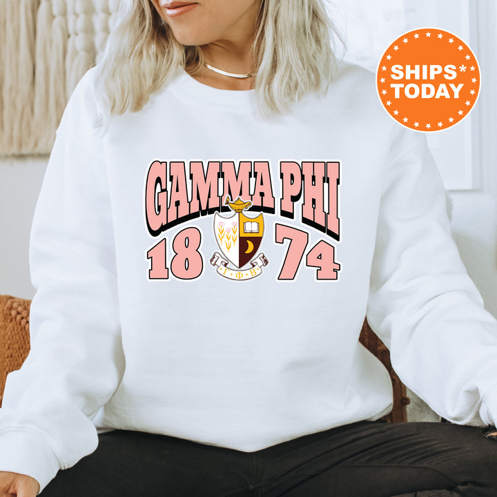a woman sitting on a chair wearing a white sweatshirt