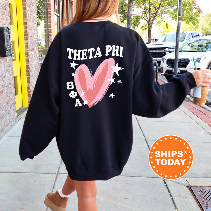 a woman walking down a sidewalk wearing a sweatshirt
