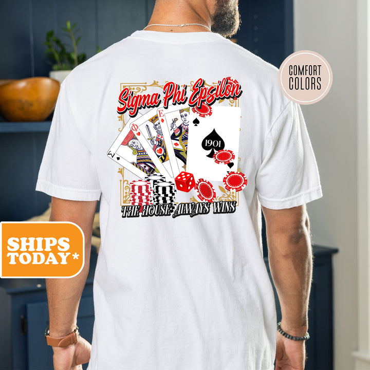 a man wearing a white shirt with a picture of playing cards on it