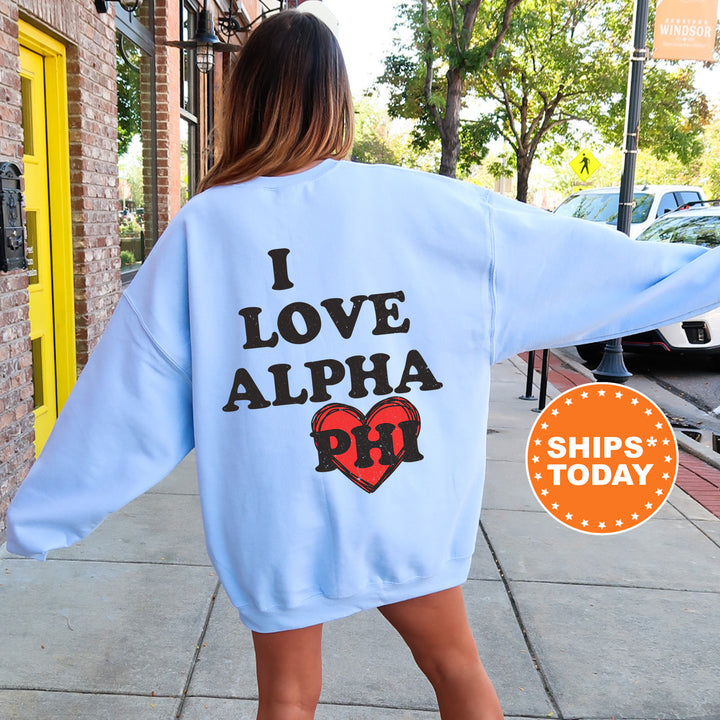 a woman walking down a sidewalk wearing a blue sweatshirt