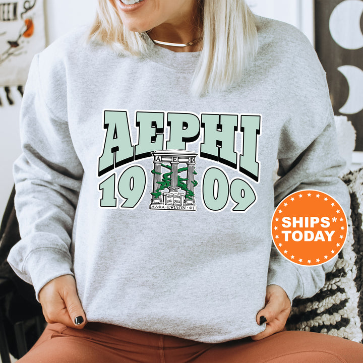 a woman sitting on a chair wearing a sweatshirt