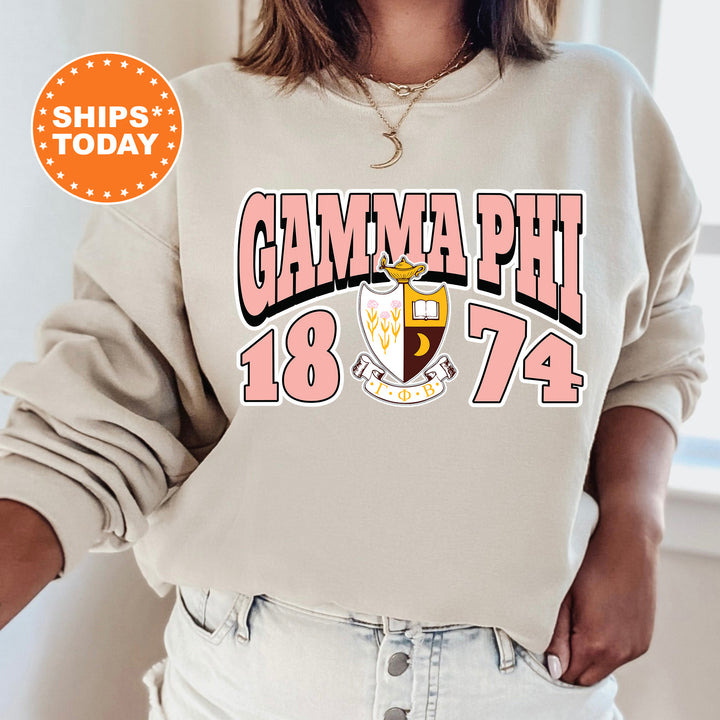a woman wearing a sweatshirt with the words glamma phi on it