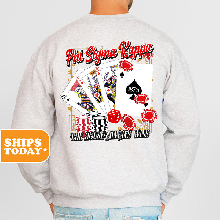 a man wearing a sweatshirt that has a picture of playing cards on it