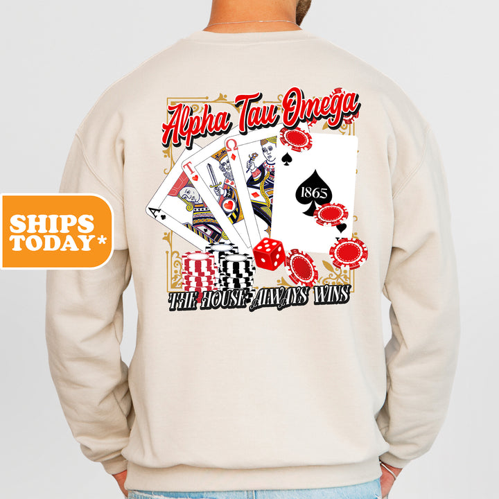 a man wearing a sweatshirt with a back print of playing cards