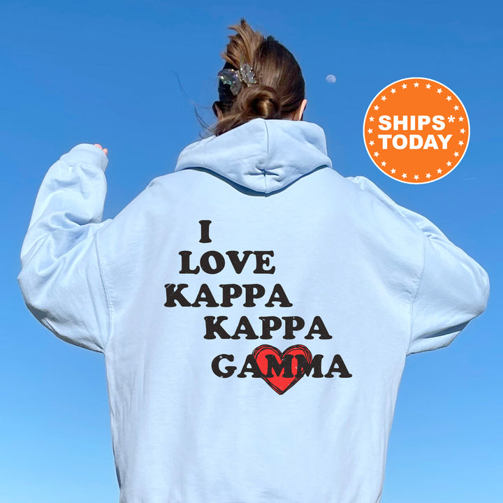 a woman wearing a white hoodie with the words i love kapa kapa