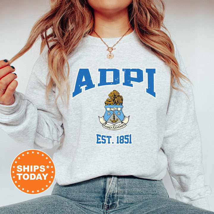 a woman wearing a sweatshirt with a crest on it