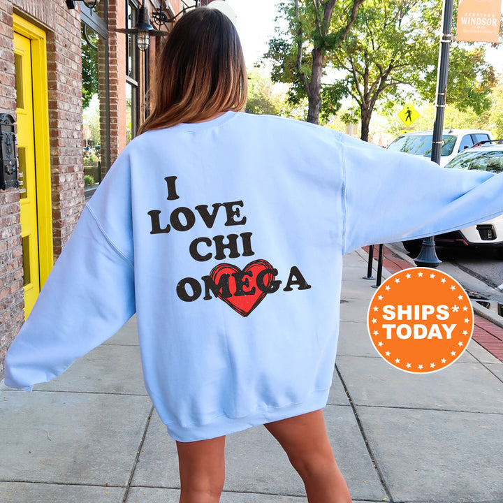 a woman walking down a sidewalk wearing a blue sweatshirt