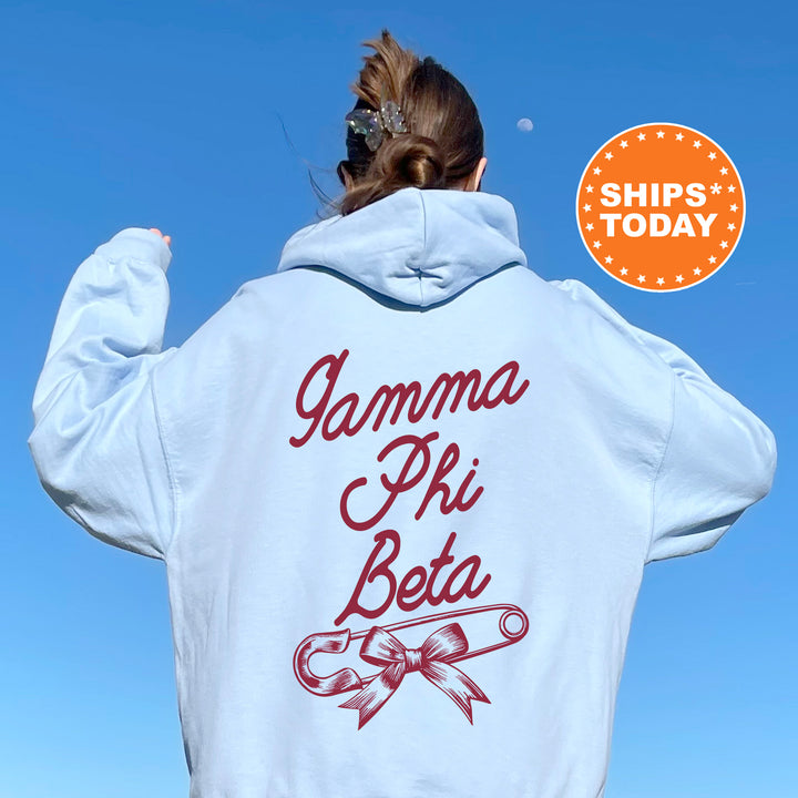 a woman wearing a white hoodie with the words gammma phi beta