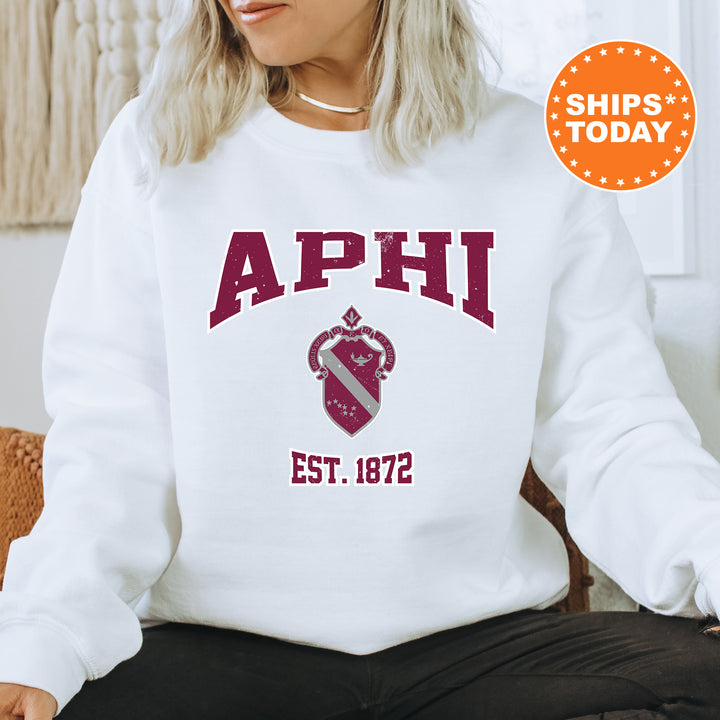 a woman sitting on a chair wearing a sweatshirt