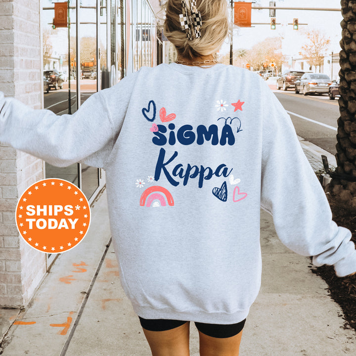 a woman walking down a sidewalk wearing a sweatshirt