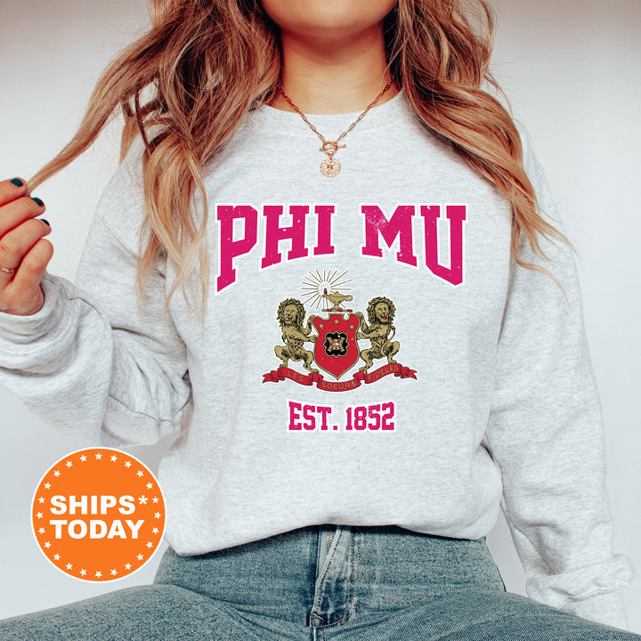 a woman wearing a sweatshirt that says phi mu