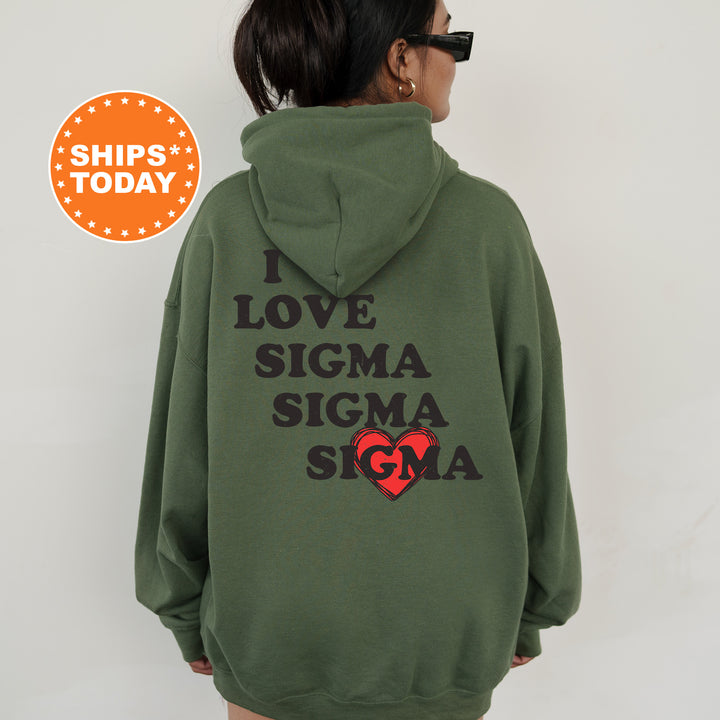 a woman wearing a green sweatshirt with the words love, stigmaa, stigmaa