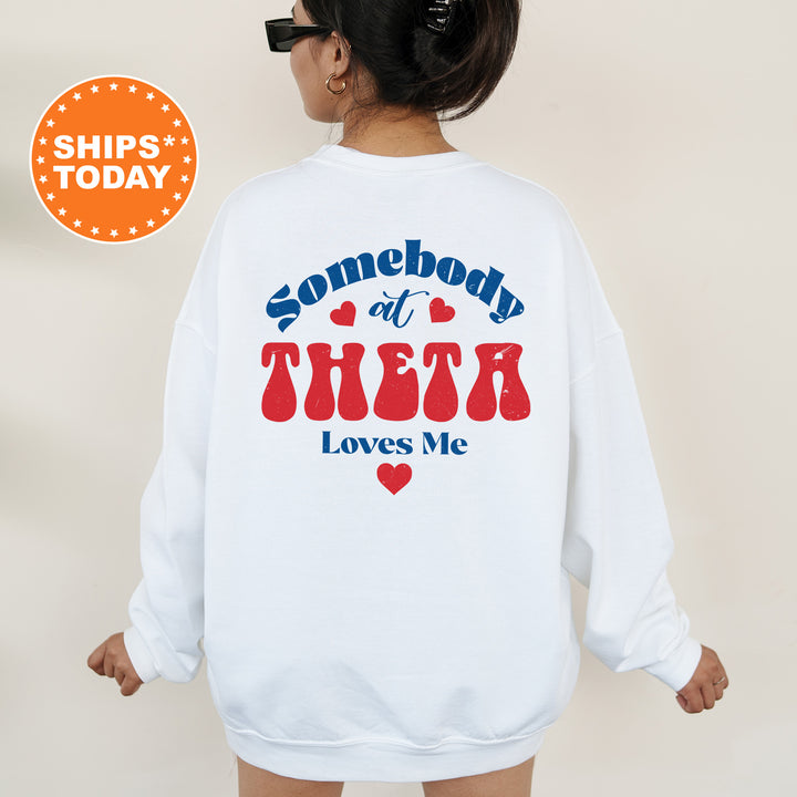 a woman wearing a sweatshirt that says somebody at their loves me