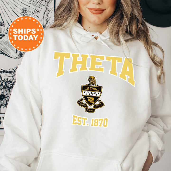 a woman wearing a white hoodie with a yellow and black logo