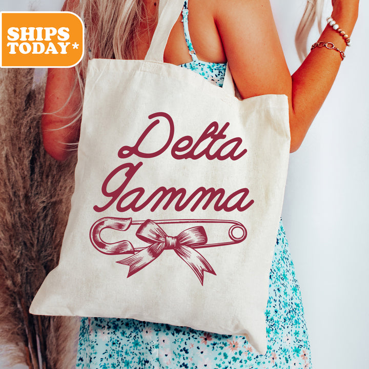 a woman holding a bag that says delta garma