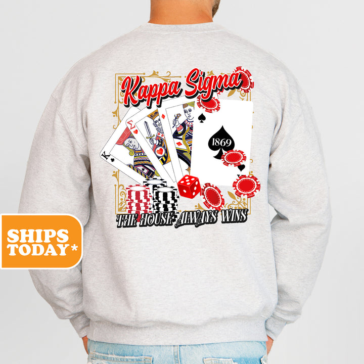 a man wearing a sweatshirt that has a picture of a playing card on it