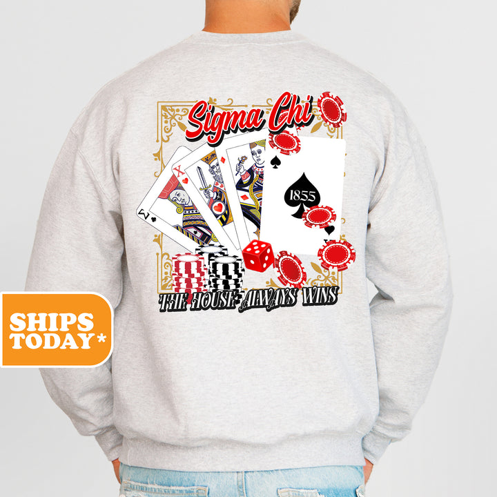 a man wearing a sweatshirt with a picture of playing cards on it