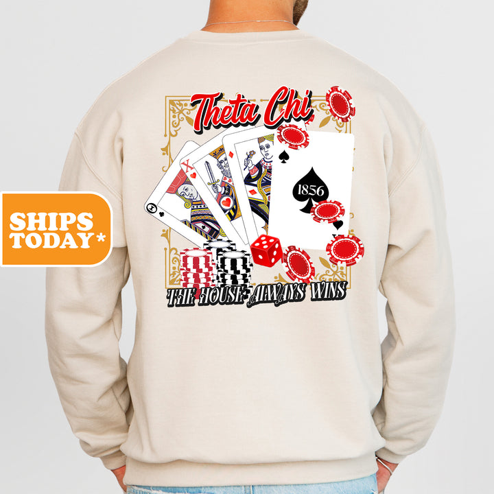 a man wearing a sweatshirt with a back print of playing cards