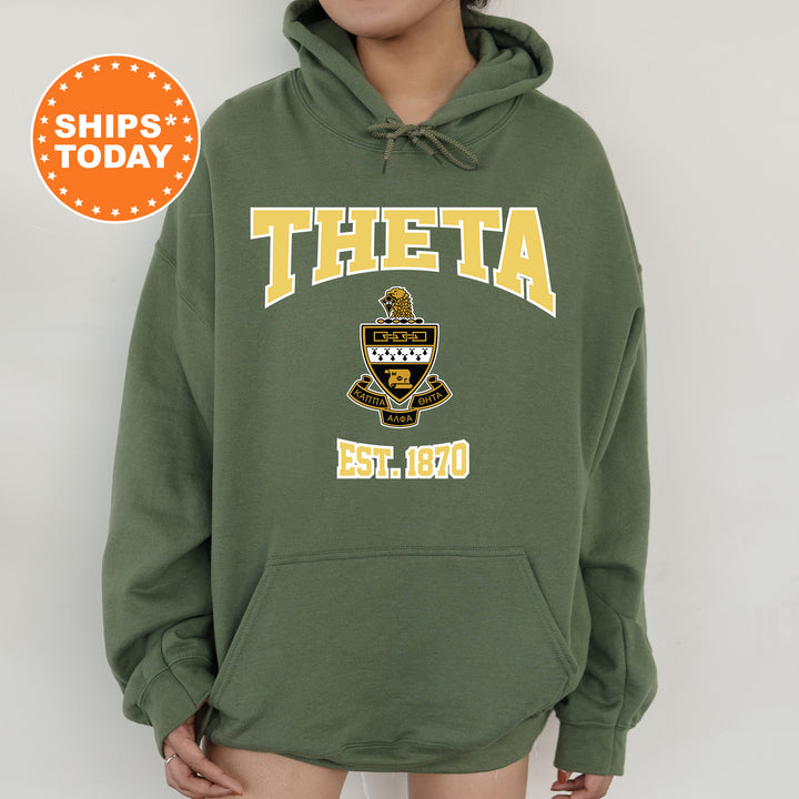 a woman wearing a green hoodie with the words theta on it