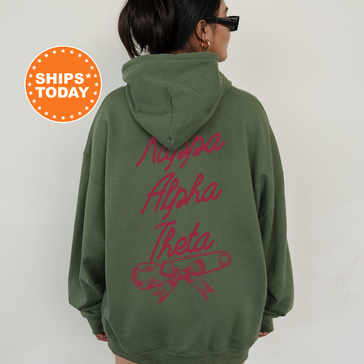 a woman wearing a green hoodie with red writing on it