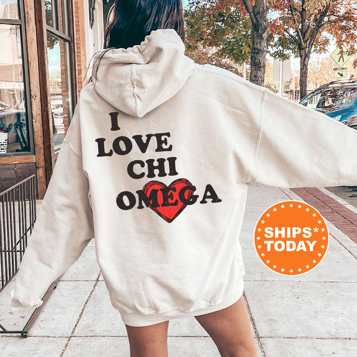 a woman in a white hoodie is walking down the street